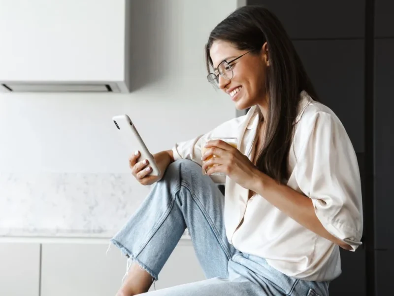 Smiling woman using an IVR solution with a business